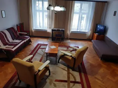 a living room with a couch and a table and chairs at Sienna 3 OLD TOWN in Kraków