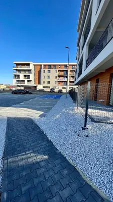 an empty parking lot next to a building at Golden 42 in Zator