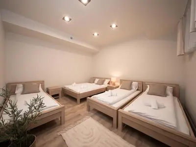 a room with two beds in a room at Sweet Dreams Apartment in Zator