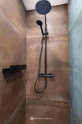 a shower with a shower head in a bathroom at City of the Kings-Szmaragd in Kraków