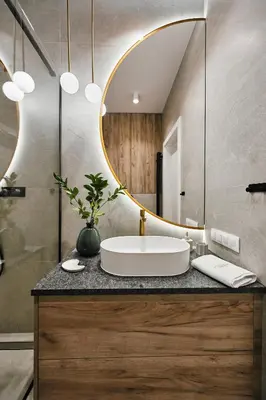 a bathroom with a sink and a mirror at Golden Dreams Luxury Apartment 81 in Kraków
