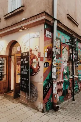 a building with a mural on the side of it at Luxury standard apartment in Cracow in Kraków