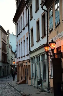 a cobblestone street in a city with buildings at Luxury standard apartment in Cracow in Kraków