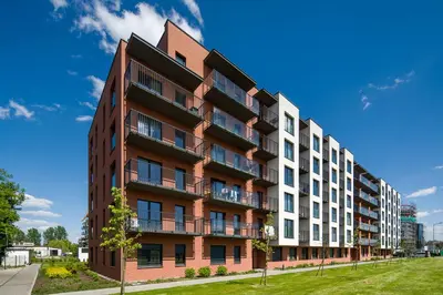 an apartment building with a red and white at In Blue Apartment in Kraków