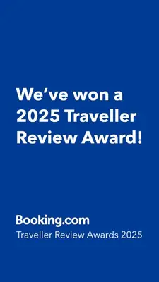 a blue sign that says weve won a traveler review award at Flora Design Old Town- Free Parking in Kraków