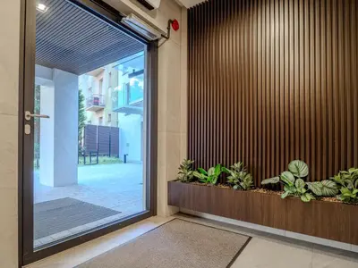 an entrance to a building with a door with plants at Loft vistula old town apartament free parking in Kraków