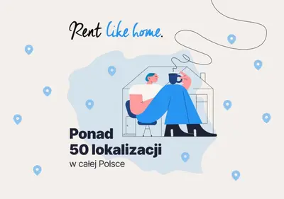 a man sitting in a chair with a cup of coffee and translated translated translated translated at Modern Apartment with Parking in Cracow by Rent like home in Kraków