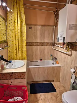 a bathroom with a tub and a sink at Agnieszki Pokoj nr 2 in Kraków