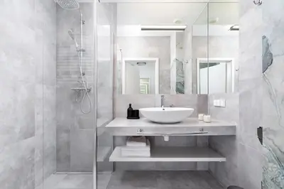 a bathroom with a sink and a shower at Studio with a balcony and AC - Rajska 3 street in Kraków