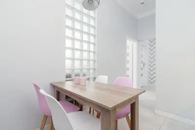a living room with a blue couch and a table at Two bedroom apartment - Starowiślna 36 in Kraków