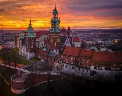 an old building with a clock tower at sunset at WANNA SPA na Starym Mieście in Kraków