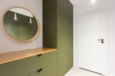 a dressing room with a mirror and a dresser at Przestronny apartament Vermelo Parking in Kraków