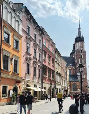 a group of people walking down a city street at Air-conditioned apartment in the city center, Old Town in Kraków
