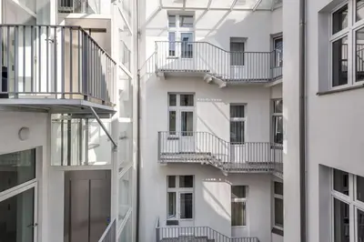 an apartment building with balconies on the side of it at Old Town Apartments - B12 in Kraków