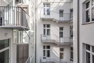 an apartment building with balconies on the side of it at Bosacka Street - Apartament B31 in Kraków