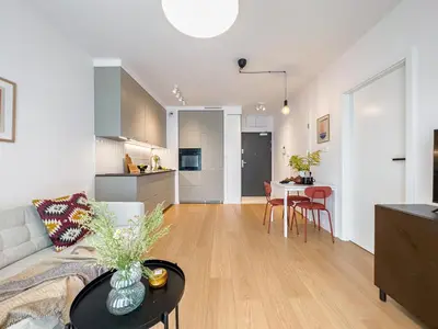 a living room with a couch and a table at Klimeckiego Luxury Apartments 189 in Kraków
