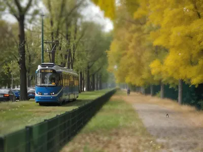 a blue bus parked on the side of a road at Cracow Fancy Brick #1 - Old Town in Kraków