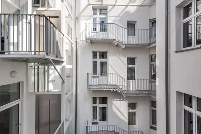 an apartment building with balconies on the side of it at Old Town Apt - Bosacka B30 in Kraków