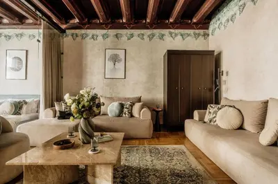a bedroom with a bed and a living room at Grodzka by Tyzenhauz in Kraków