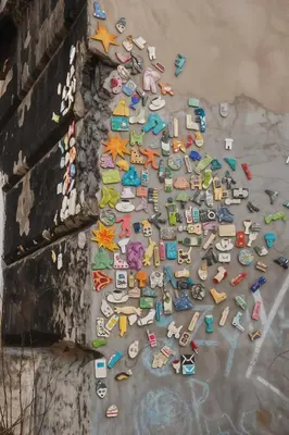 a pile of toys on the ground next to a wall at Cracow Route #3 - Old Town in Kraków