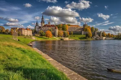 a castle on the shore of a lake with trees at Cracow Vistula Boulevard #3 - Old Town in Kraków