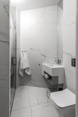 a white bathroom with a toilet and a sink at Kossak Residence - by Wawel Castle in Kraków