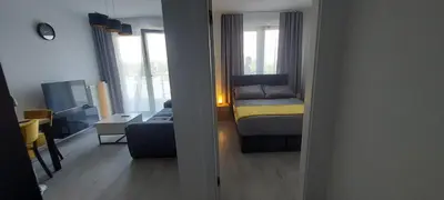 a small room with a bed and a couch at Apartament ZARA Self Check In in Kraków