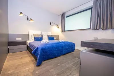 a hammock on the balcony of a house at Family Apartment with 2 bedrooms, huge balcony, Free parking, 10 minutes walk to Main Square and Kazimierz District in Kraków