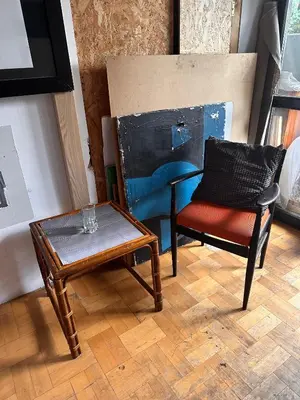 a living room with a chair and a table at Villatopol in Rząska