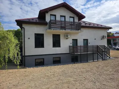 a large white house with a lot of windows at La Ville - Rouge in Zator