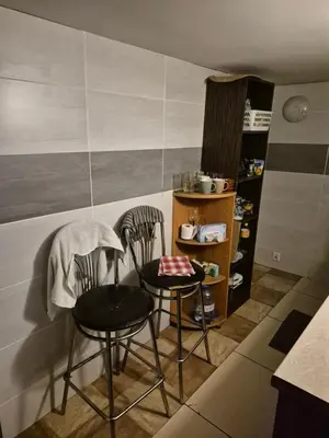 two chairs and a table in a kitchen at Pokoj u Eleni #5 in Kraków