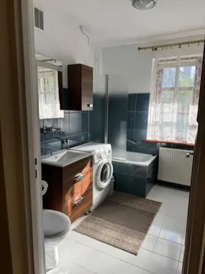 a bathroom with a toilet and a sink and a tub at Bochnia ,nocleg, pokoje, kwatery pracownicze,dom in Bochnia