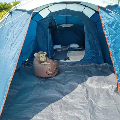 a blue tent with a teddy bear in the inside at Uszate Ranczo Malinka in Rybna