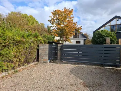 a black fence in front of a house at sPokoje in Wieliczka