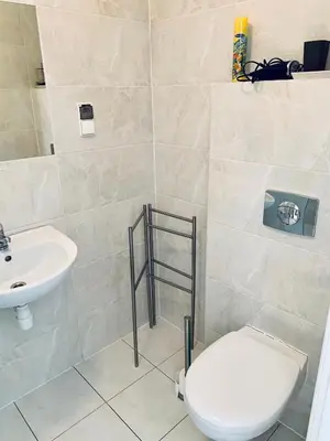 a bathroom with a toilet and a sink at Apartament w centrum in Kraków