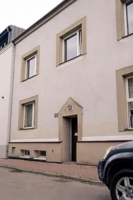 a large building with a door on the side of it at Langiewicza paradise in Kraków