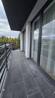 a balcony of a building with large windows at Apartamenty Żurawia 1 - Piętro 1 in Kraków