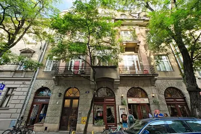 a building with a car parked in front of it at Urbannest-Augustiańska 4 in Kraków