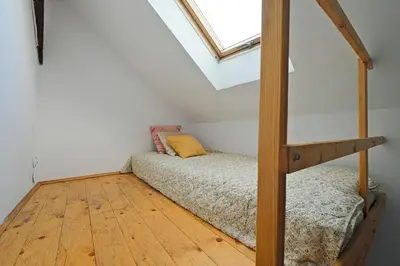 a bedroom with a bunk bed and a window at Urbannest-Augustiańska 4 in Kraków