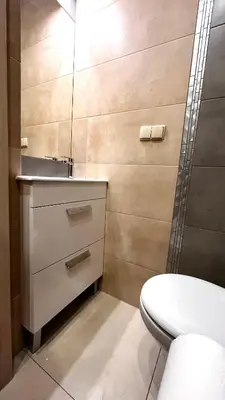 a bathroom with a sink and a toilet at Small Studio for 1 in Kraków