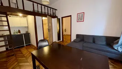 a living room with a couch and a table at Next to Main Square 2 in Kraków