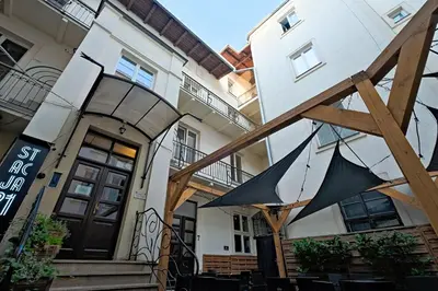 an umbrella is hanging outside of a building at Urban Nest - Double Room in the Attic in Kraków