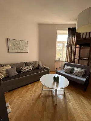 a living room with a couch and a table at Apt for six in Kraków