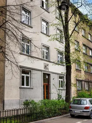 a building with a car parked in front of it at Quiet Courtyard Studio by Tyzenhauz in Kraków