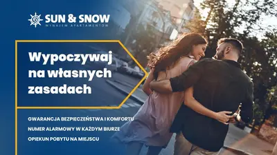 a living room with a couch and a table at Rakowicka Residence, Sun & Snow in Kraków