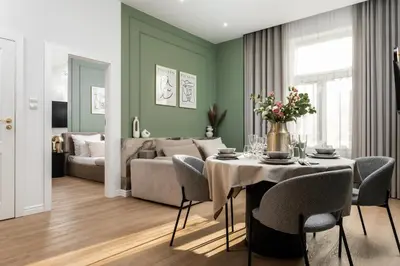 a living room with a couch and a table at 2x Perfect Apartment OLD TOWN 5min Main Market Square AC WiFi Parking Balcony in Kraków
