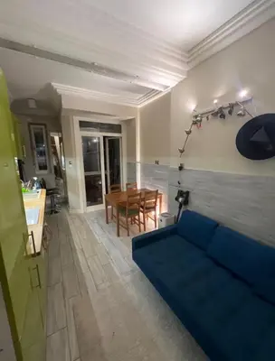 a bedroom with a bed in a room with a desk at Affordable place in city center in Kraków