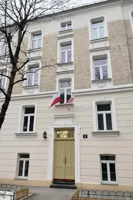 a kitchen and living room with a glass table and chairs at Old Town Apartment with Private Rooftop Jacuzzi and the Sky Views ! Balcony AC WiFi Parking in Kraków
