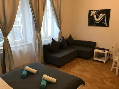 a small living room with a couch at Apartments on Miodowa in Kraków