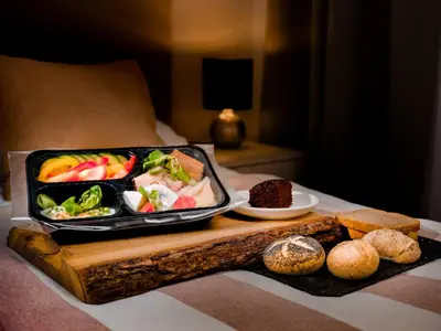 a tray of food on a table with a tray of food at Apartamenty i Studia HERBARIUM in Kraków